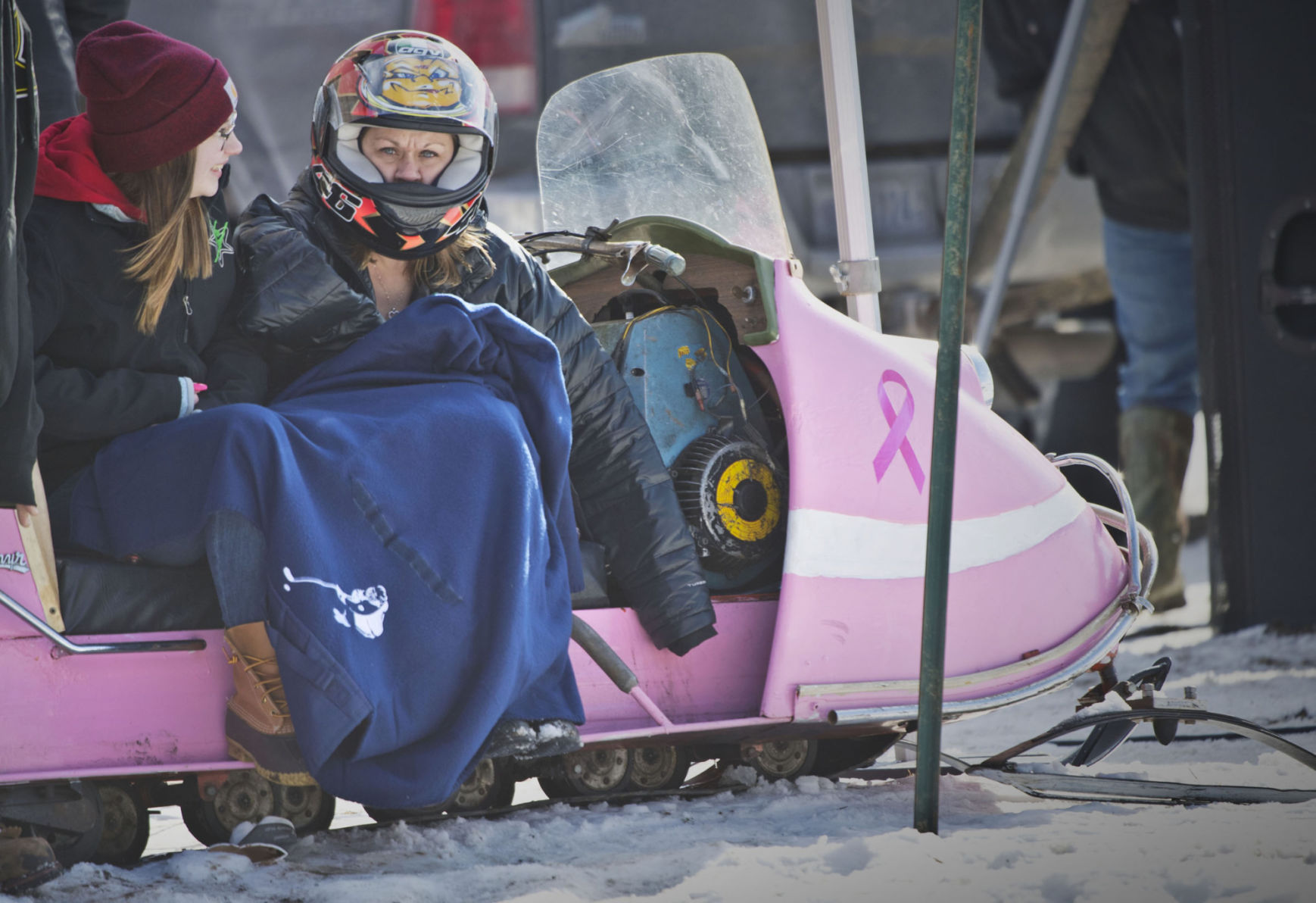 Bikini-clad snowmobilers rally again to fight breast cancer